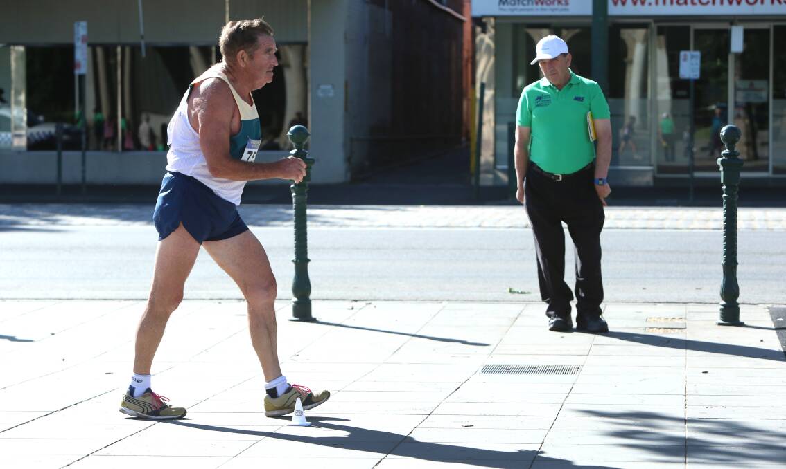 HOME TRACK: Geoff Major from Eaglehawk powers along Pall Mall as he contests the 75-79 years class of the 10km walk at the Oceania Masters athletics titles in Bendigo. Picture: PETER WEAVING 