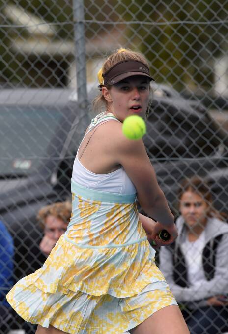 TOP SHOT: Bendigo's Adelaide Annand plays a backhand drive in her victory in the 16-under girls' singles. Picture: JODIE DONNELLAN