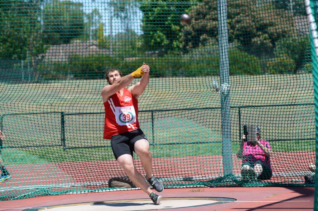 CLASS ACT: Tim Driesen competes in the refurbished hammer cage at the Latrobe University Bendigo athletics complex in Flora Hill. 