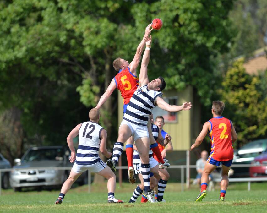 PANTHER LEAPS:Marong's Chris Morgan wins this centre ball-up in the round two clash with YCW. 