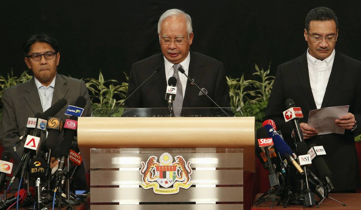 Malaysia's Prime Minister Najib Razak makes an announcement on the latest development on the missing Malaysia Airlines MH370 plane at Putra World Trade Center in Kuala Lumpur March 24, 2014. Prime Minister Najib has told families of passengers of a missing Malaysian airliner that the plane ended its journey in the southern Indian Ocean. Photo Reuters.