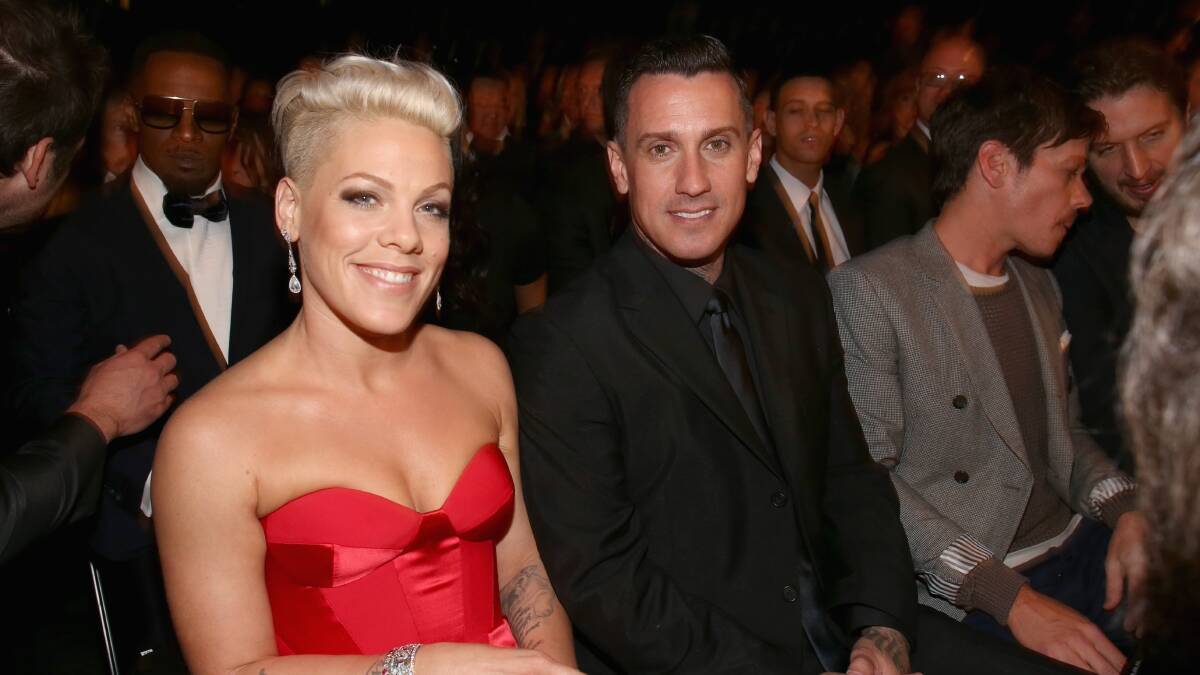 Singer Pink (L) and motorcycle racer Carey Hart attend the 56th GRAMMY Awards at Staples Center on January 26, 2014 in Los Angeles, California. Photo: GETTY IMAGES
