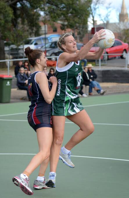 Nina in action for Kangaroo Flat in 2012, against former Sandhurst defender and new Melbourne Vixen recruit Chloe Watson. Picture: MATT KIMPTON
