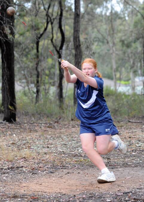 IN A SPIN: Hammer thrower Olivia Graham, 13, shows her style. Pictures: JODIE DONNELLAN