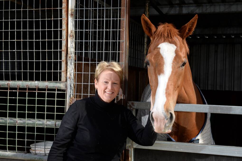 Prominent racing identity Briga Fliedner with Molly at the family racing stables.