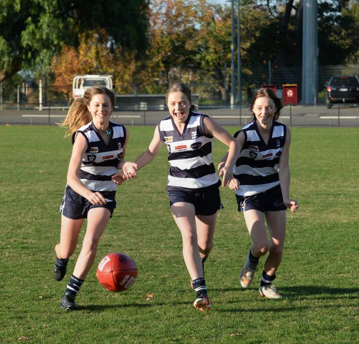 The Edlin girls chase the footy. Picture: JIM ALDERSEY