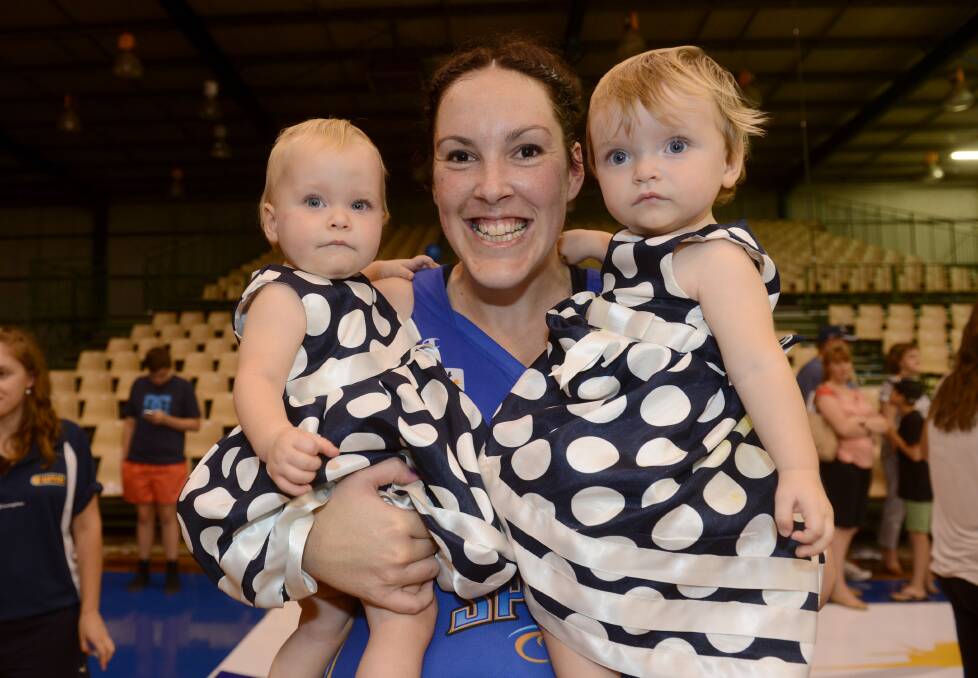 Gabe with her twin nieces Ava and Isabel Gordon after the 2013 WNBL grand final win. Picture: JULIE HOUGH