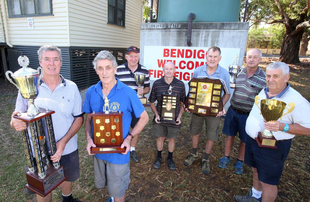 ALL SET: Fire brigade championships organising committee members Barry and Len Doye, Les Rodda, Keith Gilbee, Lawrie Boston, Laurie Anderson and Ted Carruthers with the winners’ trophies. Picture: GLENN DANIELS 