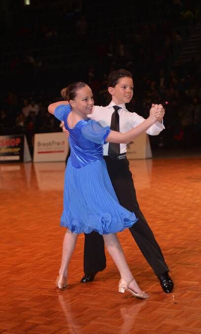 RISING STARS: Ballroom dancers Berkley Wood and Sam Brown out on the floor. Picture: DANCESPORTPHOTO.NET