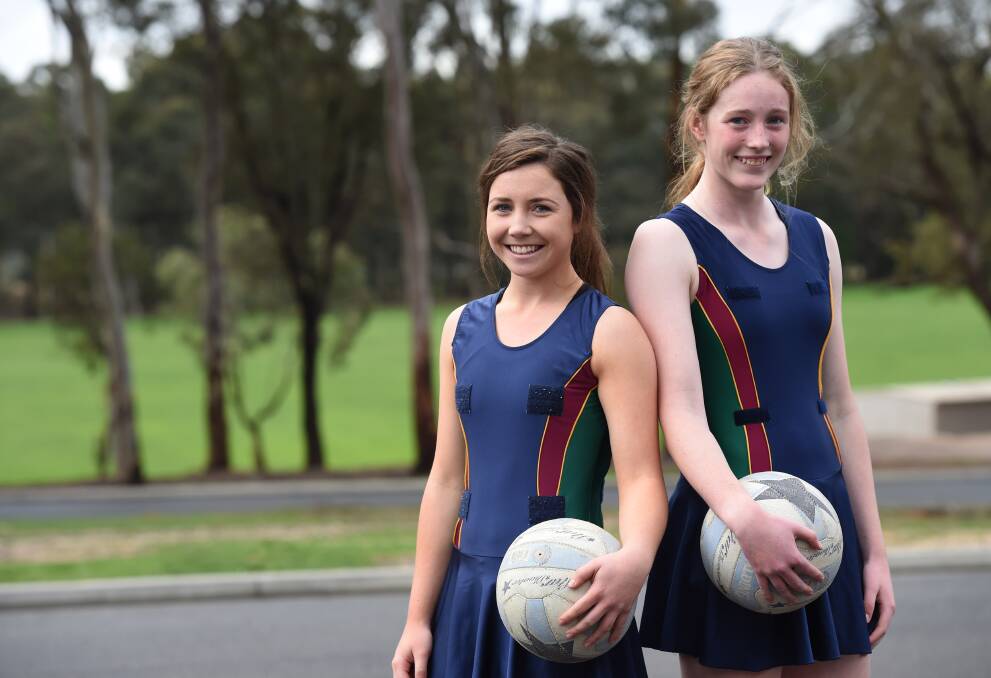 TEAM-MATES: CCB students Meg Williams and Imogen Sexton have played netball in the same school, club and rep teams and are now in a Victorian squad together. Picture: JODIE DONNELLAN 