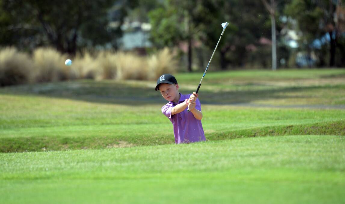 Jazy practises chipping out of a bunker at Neangar Park. Picture: BRENDAN McCARTHY