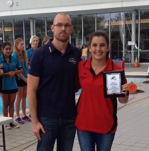 Water polo star Lily Pridham receives her award for top goal scorer at the under-14 Australian club championships. Picture: CONTRIBUTED