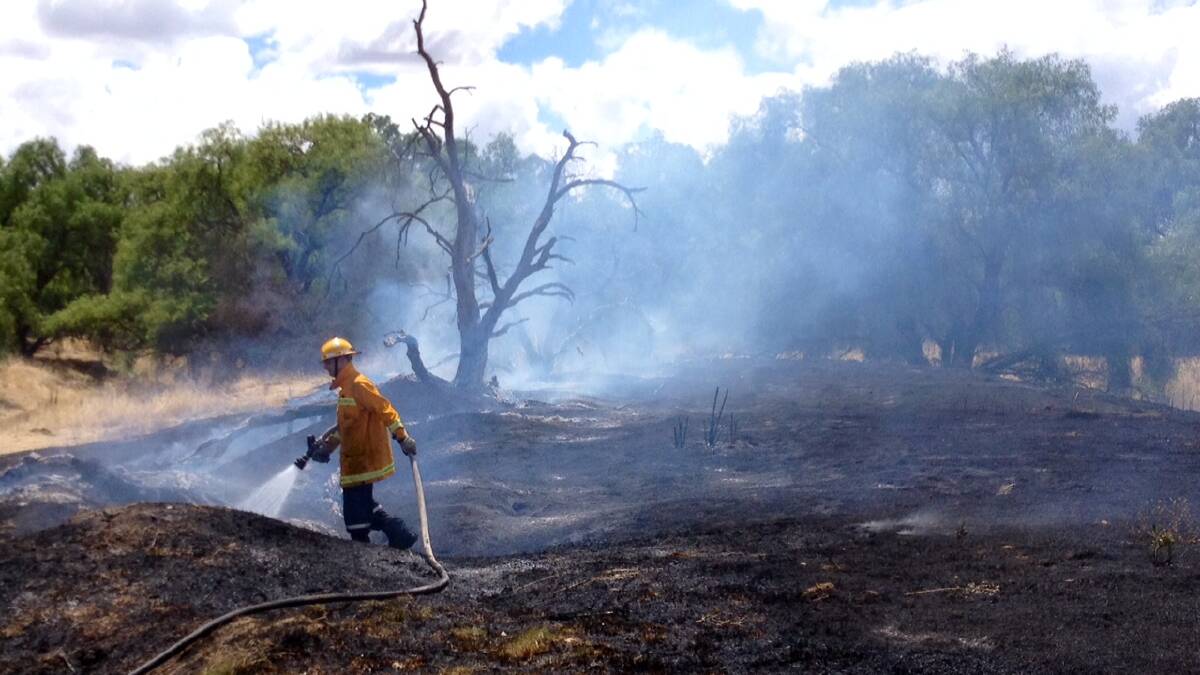 Firefighters on the scene of a grass fire in Howard St Epsom.
Picture: BRENDAN McCARTHY