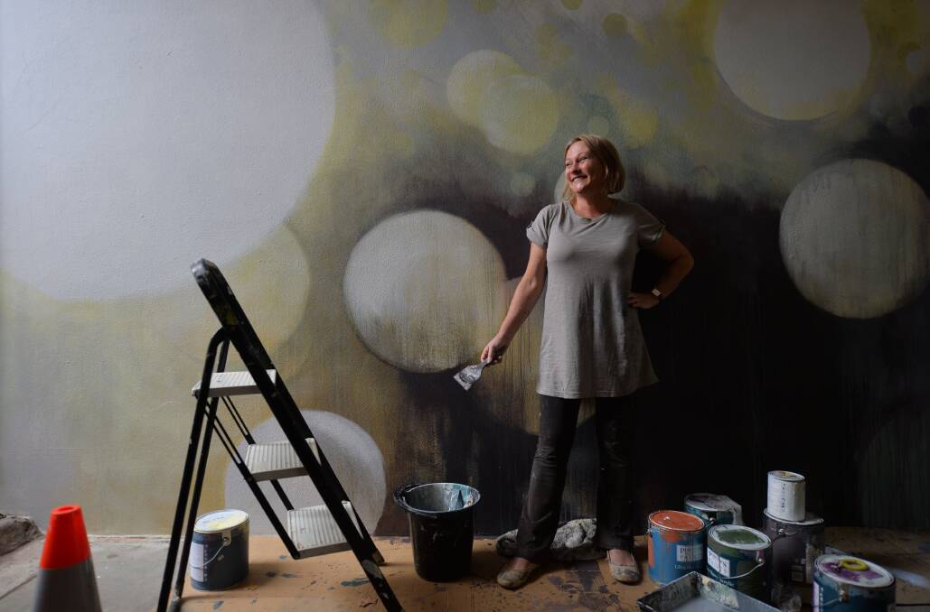 Artist Julie Andrews workin on the mural in Chancery Lane
Picture: BRENDAN McCARTHY
