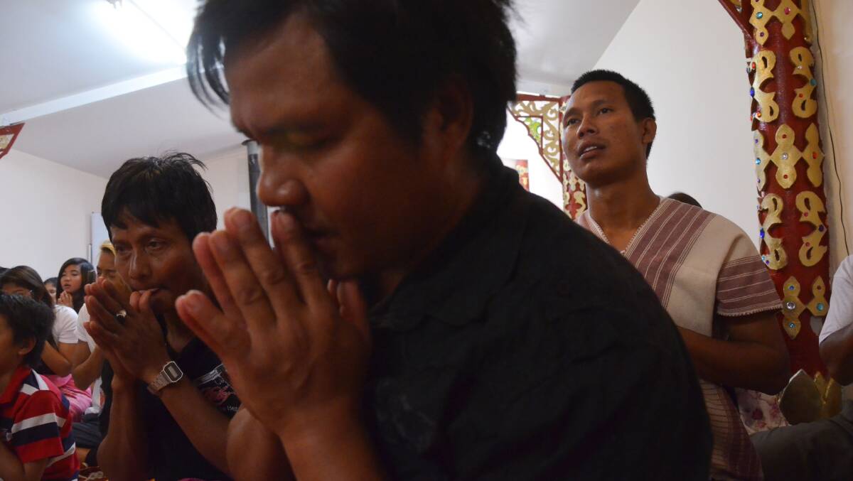Saw Ka, Kaw Lo Maung Oh Ngwe, and Ah Thay during community prayers.