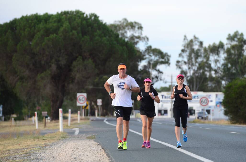 Jeff Brennan ran from Echuca to Bendigo. He is pictured with Michelle Bourke and Helen Kavanagh just past Huntly.

Picture: JIM ALDERSEY
