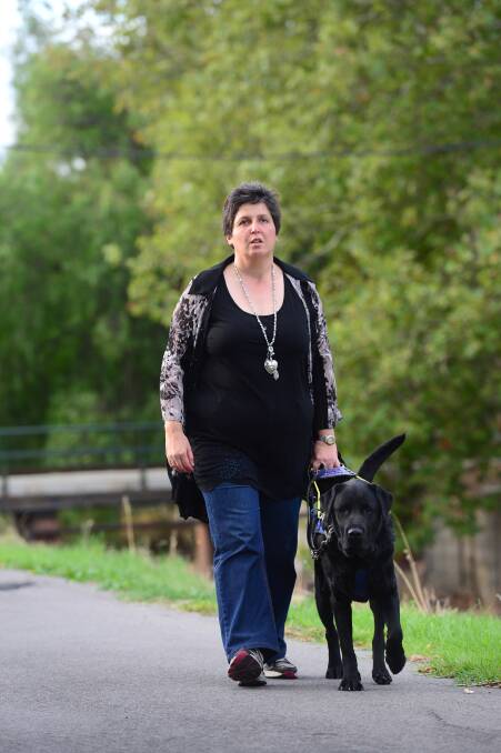 FRIENDS: Kim Ritchie and her seeing eye dog Obama. Picture: JIM ALDERSEY

