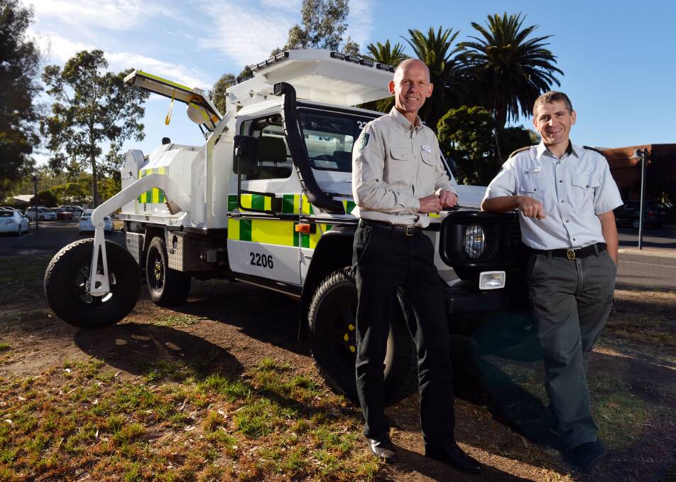 Carsten Nannestad and Simon Brown with the new fire fighting vehicle. Picture: BRENDAN McCARTHY

