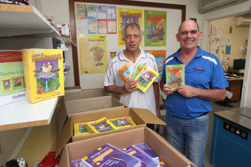 EXPANDING: Stan Kluzek and Andrew Coldwell with their home reading program. Picture: PETER WEAVING