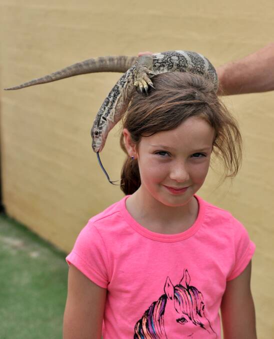 Tori Roberts with Spencer the goanna. Picture: JODIE DONNELLAN 
