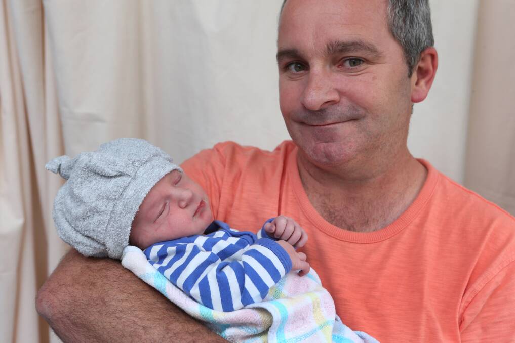 HELLO WORLD: Peter Anderson holds his son Jack who was born at 7.48am on New Year's Day. Picture: PETER WEAVING 