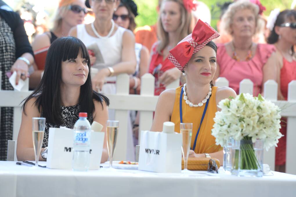 Cue Clothing state manager Josie DaRouos and Marnie Hart judge the fashions on the field at the Bendigo Cup. Picture: JIM ALDERSEY
