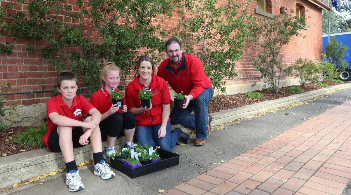 FUN: Epsom primary students Ryan Clark and Bree Veale with Kirsty Patterson and Paul Noel from Bunnings. Picture: PETER WEAVING