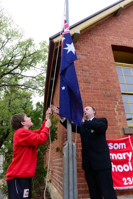 NEW FLAG: The Australian flag is raised. 
