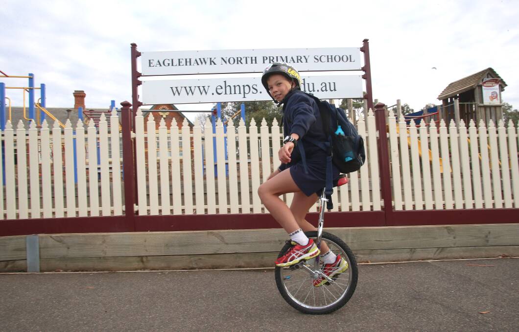 Brodie James who got a unicycle for Christmas and now rides to school. Picture: PETER WEAVING