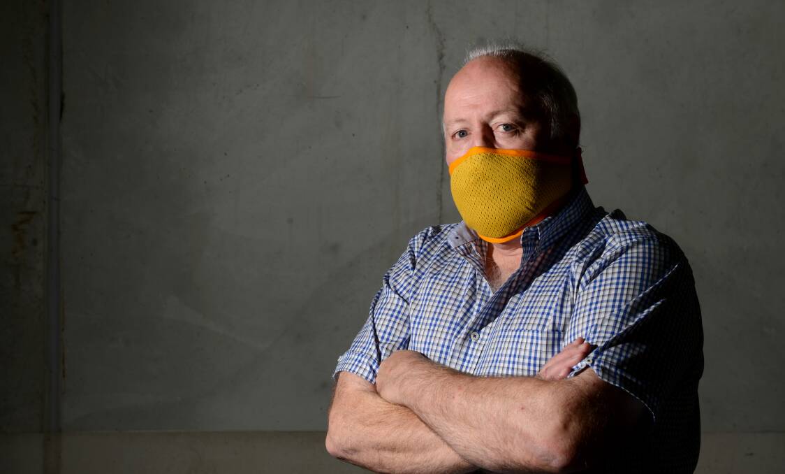 INNOVATIVE: Mike Taylor with the reusable safety mask in 2011. Picture: JIM ALDERSEY