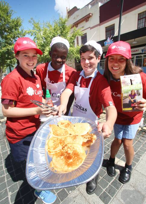 Maggie Coghlan, Yohannes Basha, Harry Enever and Meg Patterson from catholic college. Picture: PETER WEAVING