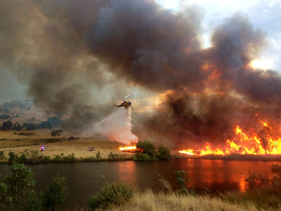 Crews fight a fire in Harcourt. Picture: John Stancombe 