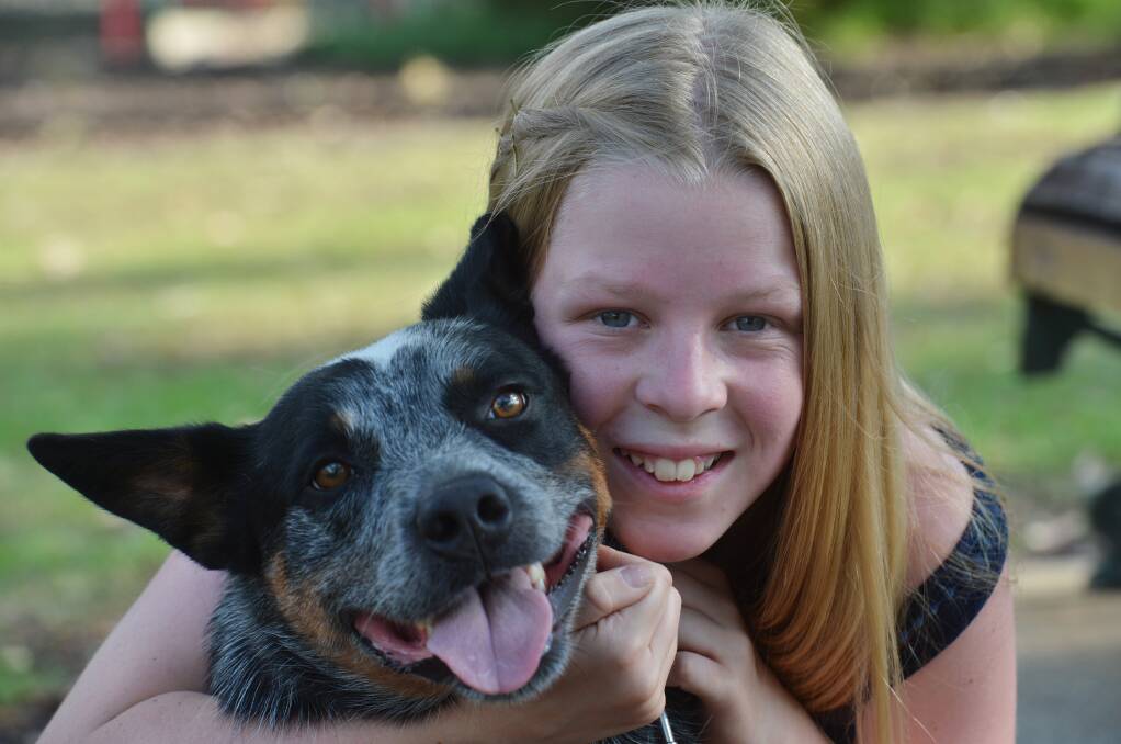 COMPASSIONATE AND CARING: Kiara Nickson, pictured with the family's pet dog Archie, is an animal lover. Pictures: BRENDAN McCARTHY