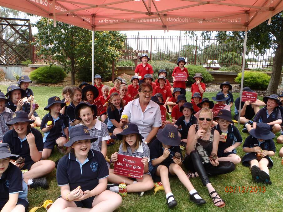 CELEBRATING: Tracie Kyne with students from Elmore Primary School and Our Lady of the Sacred Heart.