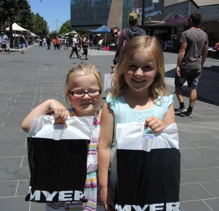 BIG SHOPPERS: Lucy, 4, and Emily, 6, Edwards show off their recent purchases.