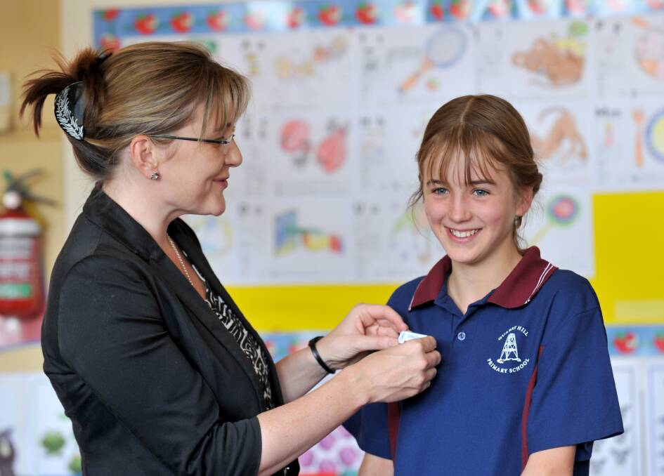 Emma Greenall receives her badge from Jacinta Allan MP. Picture: JODIE DONNELLAN 
