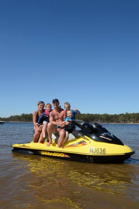 Lorelly Soyer and Joel Brown with Steve, Ethan and Joshua Carter at the Lake Eppalock Holiday Park. Picture: JIM ALDERSEY
