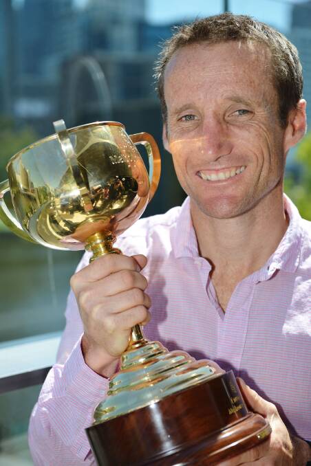 Last year's winning jockey Damien Oliver with the cup. Picture: GETTY