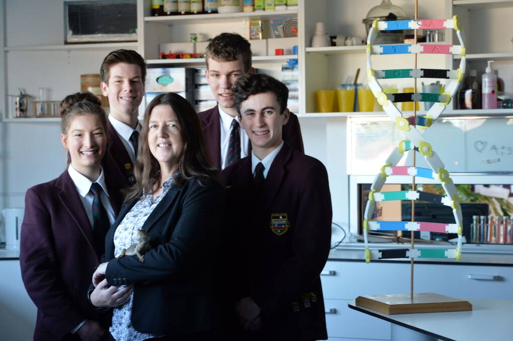 Jane Reaburn with the four students. Picture: BRENDAN McCARTHY