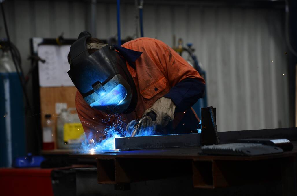 Welder Brad Niemann from the Australian Turntable Company in the factory where the temperature can rise well above the outside air temperature.

Picture: JIM ALDERSEY
