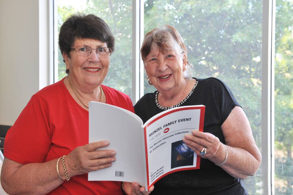 FAMILY HISTORY: June Dorman and Marie Henkel with the book they wrote with their brother Colin Munzel. Picture: BRIAN SEMMENS 