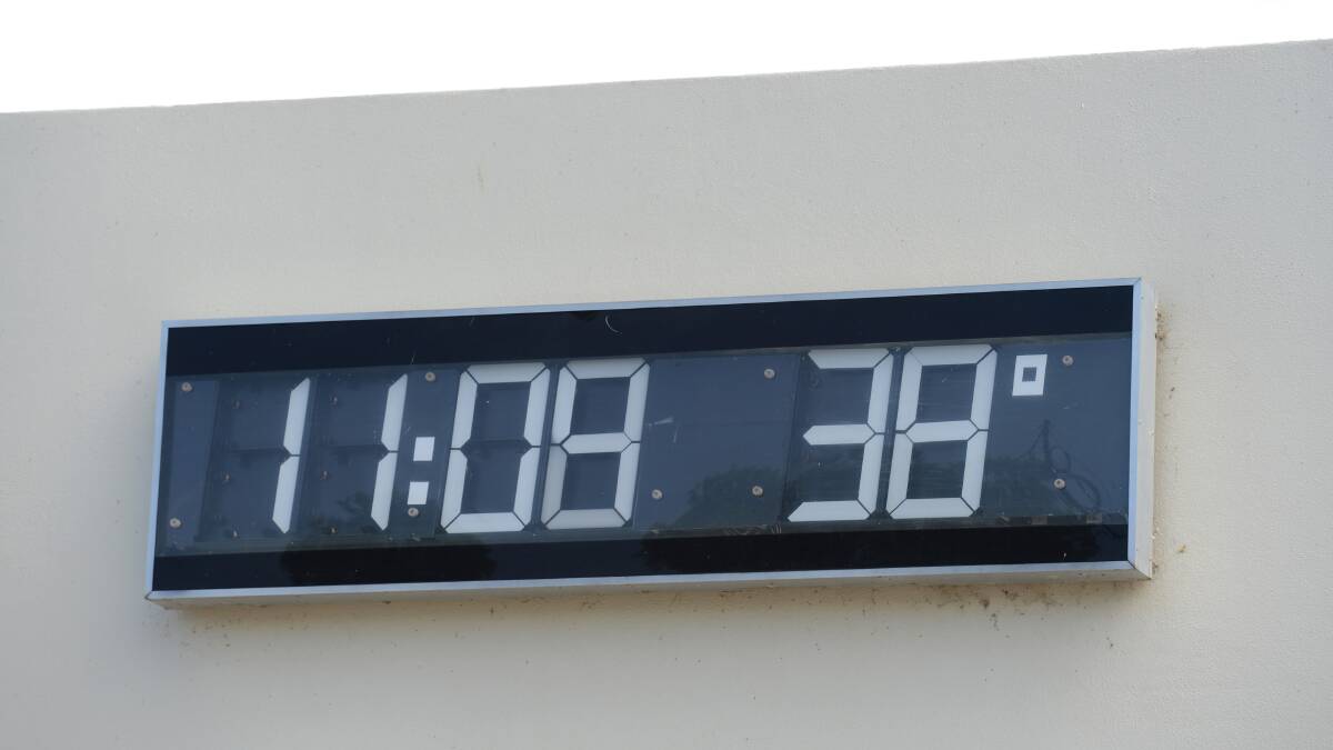 MERCURY RISING: The Bendigo Bank clock records the temperature yesterday. 