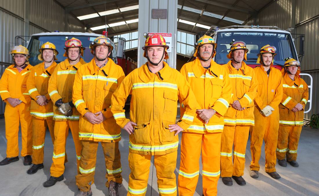 ON GUARD: Redesdale CFA members at the ready, headed by captain Glenn Brown. Picture: GLENN DANIELS