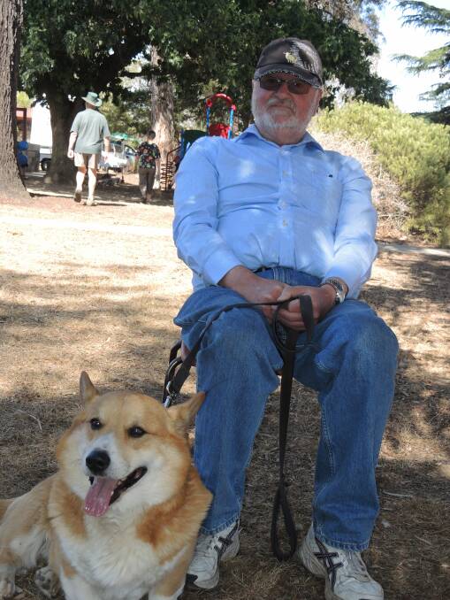John Starr of Castlemaine rests in a shady spot with his corgi, Mr Bucks. Picture: DOROTHY COOK