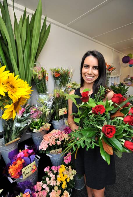 ROMANCE: Apprentice florist Selina Weragoda. Picture: JODIE DONNELLAN 