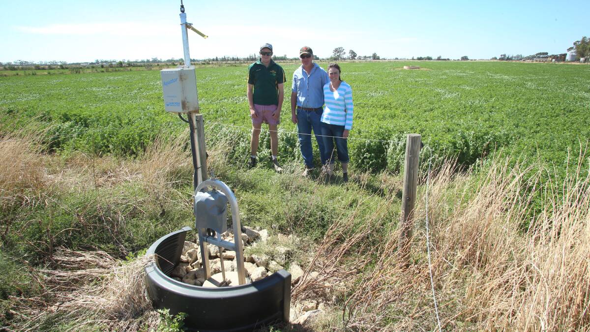 Peter and Donna Sexton and son Billy at their Dingee property which has a fully automatic pipe and riser remote control irrigation system.
Picture: PETER WEAVING