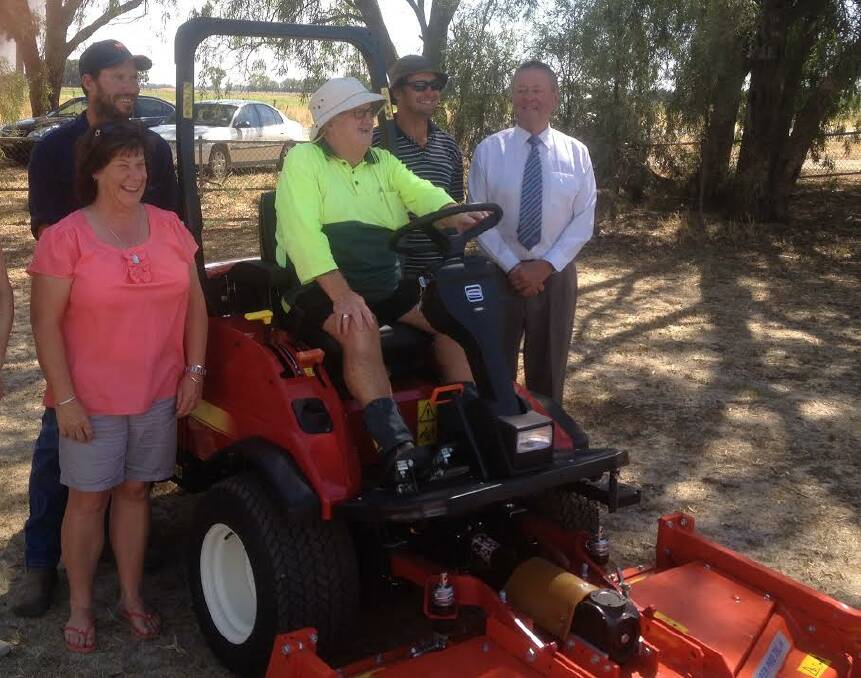 IN THE HOT SEAT: Alan Fidler test drives the new mower at Calivil Recreation Reserve.