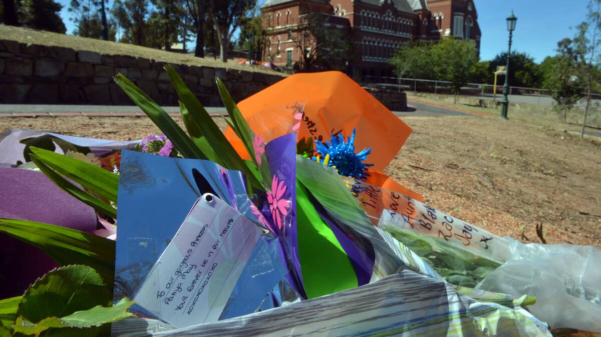 NOT FORGOTTEN: Flowers for Patiya May at the scene of the tree collapse in Rosalind Park
Picture: BRENDAN McCARTHY