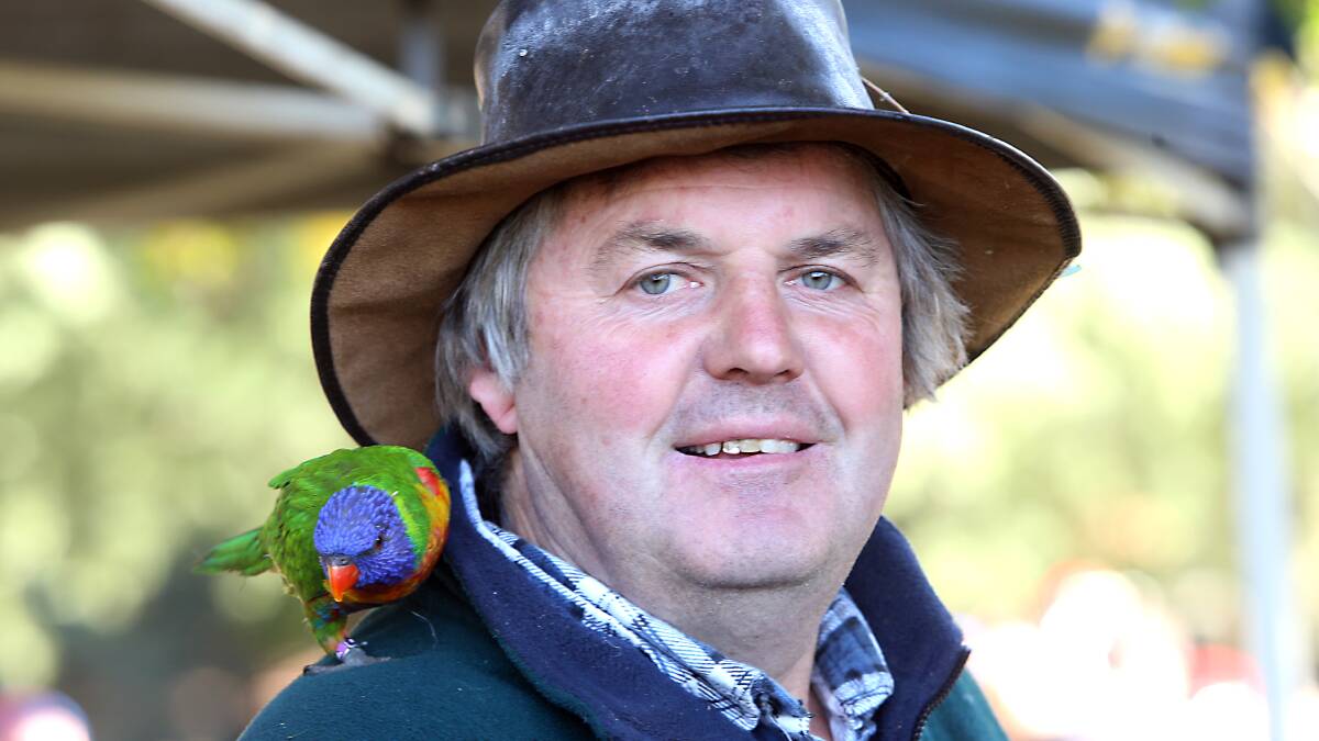 Farmer Darryl Sheridan, with 10 year old polly on his shoulder. Picture: GLENN DANIELS