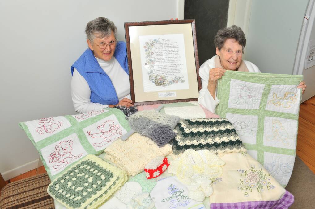 Treasurer Val Coghill and President Iris Benbow with some of the items that will be on display. Picture: BRIAN SEMMENS